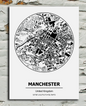 black and white metal sign of Manchester City