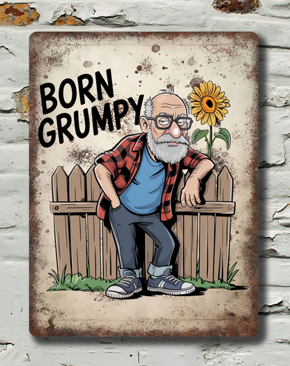 Decorative sign with a cartoon character and 'Born Grumpy' text on a textured wall background.