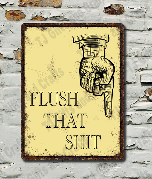 A rectangular vintage-style metal sign with a distressed cream background and dark brown border, featuring an illustration of a hand holding a toilet paper roll and the text 'FLUSH THAT SHIT'. The sign is mounted on a white brick wall with peeling paint.