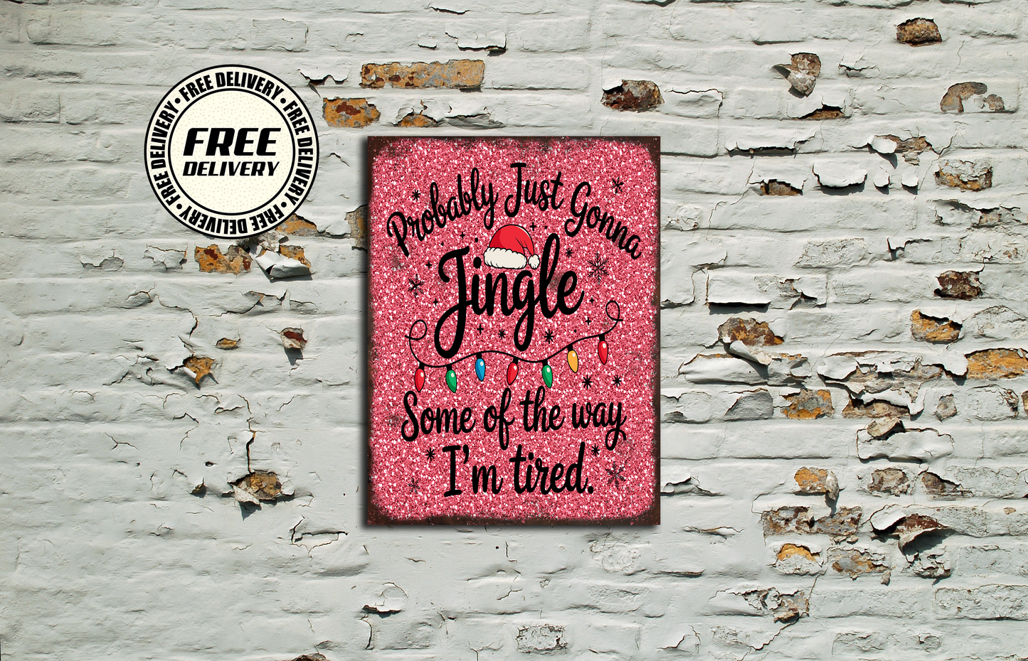 Pink sign with Christmas text on a textured wall background