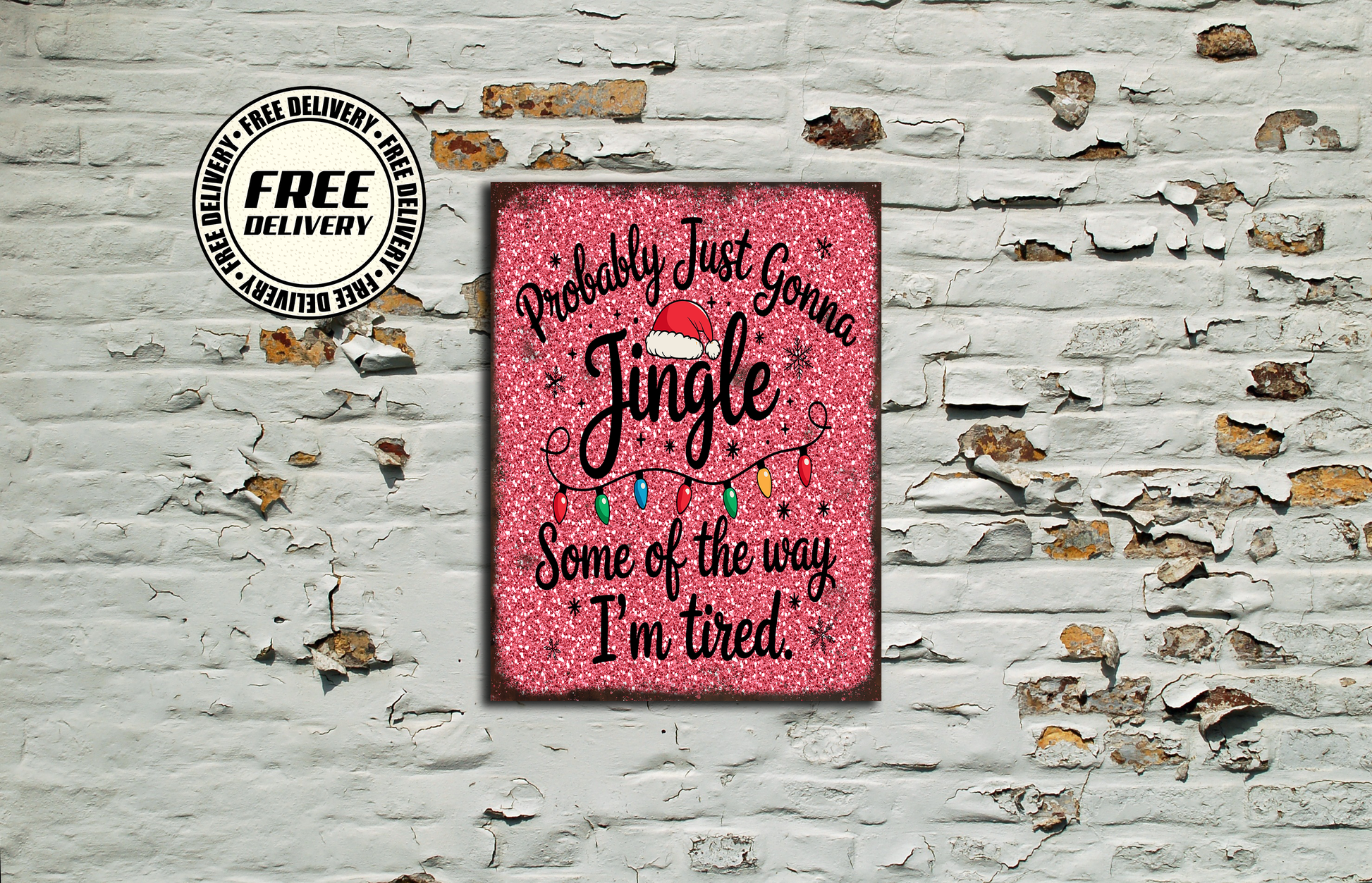 Pink sign with Christmas text on a textured wall background