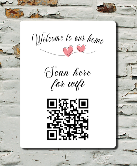WiFi QR code sign on a textured wall with 'Welcome to our home' text