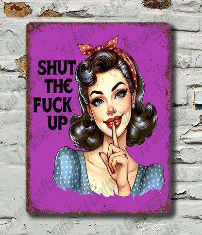 Vintage-style sign with a stylized woman's face and text on a textured wall background