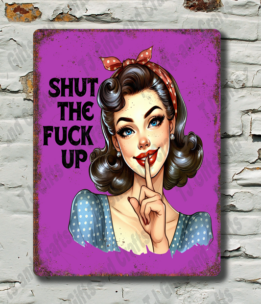 Vintage-style sign with a stylized woman's face and text on a textured wall background