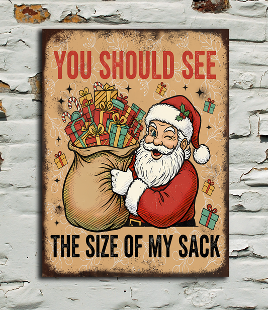 Vintage-style sign with Santa Claus and text 'You should see the size of my sack' on a textured wall background.